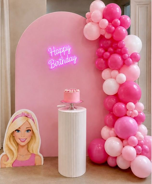 Pink Barbie themed birthday arch with neon Happy Birthday sign and balloon garland